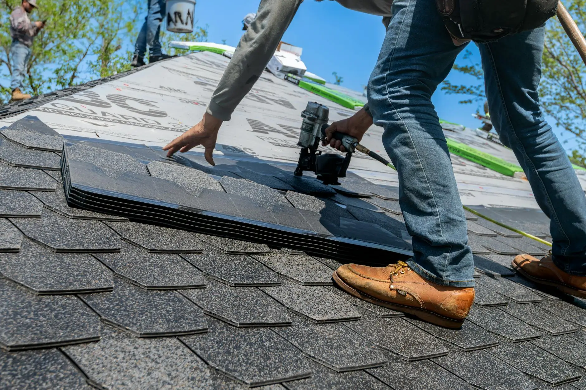 A close-up of high-quality architectural shingles installed with precision, showing clean valley flashing and robust ventilation.