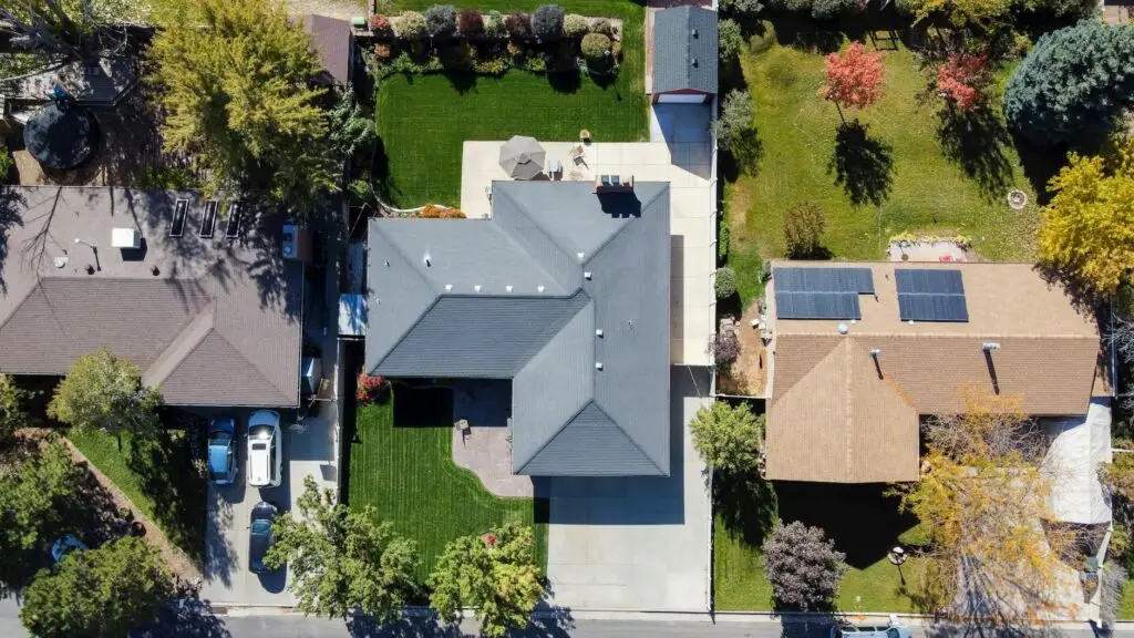 A professional roofing crew installing high-quality underlayment on a South Jordan residential roof.