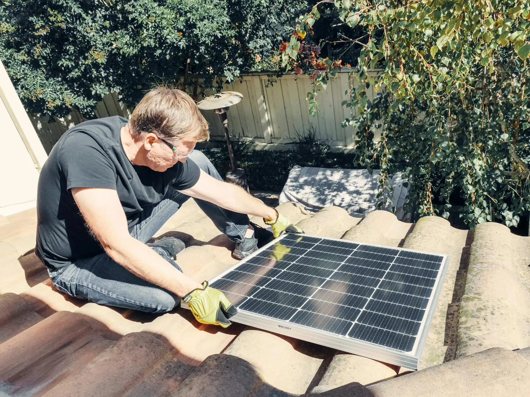 An experienced roofing inspector examining shingles for hail damage on a home in Riverton, Utah.